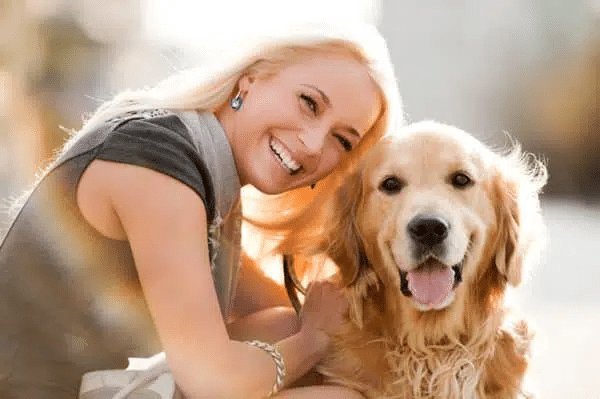 In-home dog training session in Phoenix, AZ featuring a pet parent and her Golden Retriever